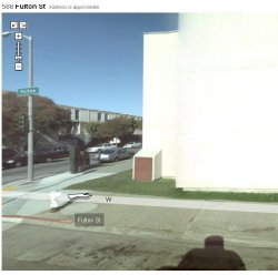 This is a shadow of the 360-degree camera on top of the Google Street View vehicle.  Photo is on Fulton Street in San Francisco (in the 500 block).  Nearby Laguna Street has a police unit following the Google camera around.  Wonder if they were suspicious enough to get pulled over.
(ShorpyBlog, Member Gallery)